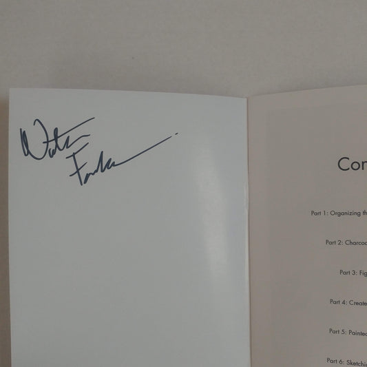 An open book or booklet showing a white signature page with a dark ink signature on the left page and a light beige instruction or table of contents page on the right page.