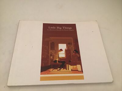 A book titled 'Little Big Things' resting on a light beige surface. The book cover is primarily white with a central reddish-brown illustration depicting a cozy interior scene with a person sitting at a desk.