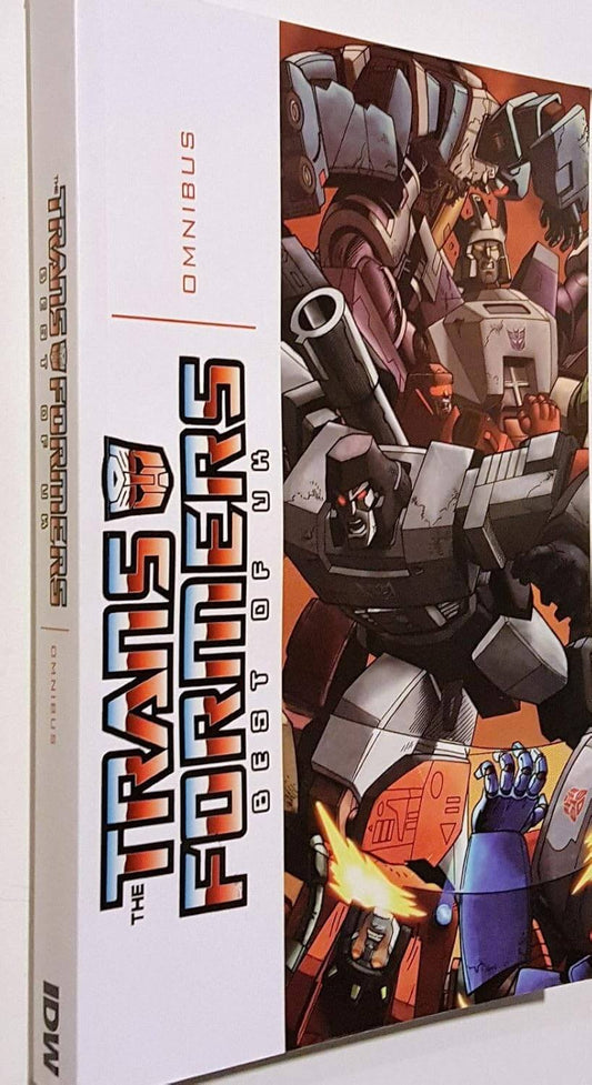 Angled view of the Transformers Best of UK Omnibus paperback showing the spine and cover branding.