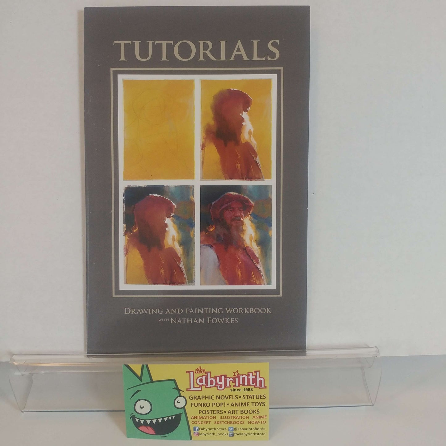 Signed instructional book titled 'Drawing & Painting Nathan Fowkes' with a printed image of a character on the cover.