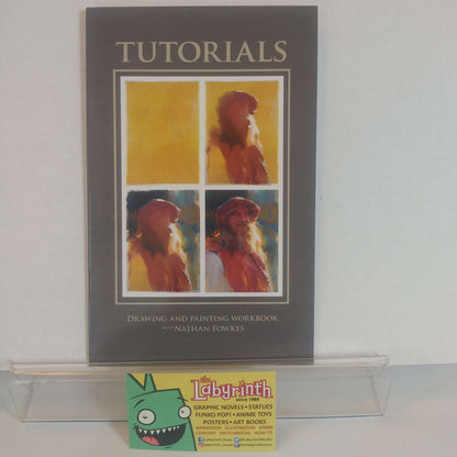 Signed instructional book titled 'Drawing & Painting Nathan Fowkes' with a printed image of a character on the cover.