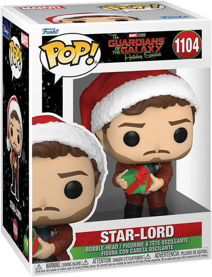 Funko Pop! Marvel Star-Lord Holiday Special vinyl figure in its original window box packaging, featuring the character in a red Santa hat and suit holding a green gift box.