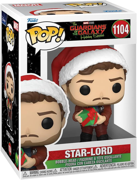 Funko Pop! Marvel Star-Lord Holiday Special vinyl figure in its original window box packaging, featuring the character in a red Santa hat and suit holding a green gift box.