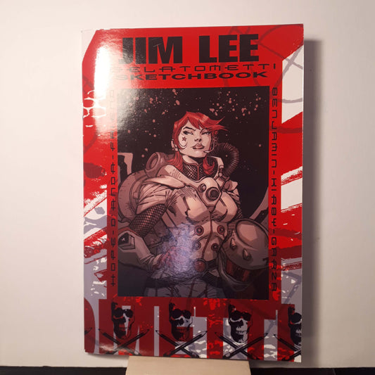 A sketchbook art book with a red and black cover featuring a graphic illustration by Jim Lee, with the title 'Jim Lee Gelatometti Sketchbook'.