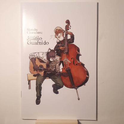 Signed sketchbook by Juanjo Guarnido featuring sketches of characters playing musical instruments.