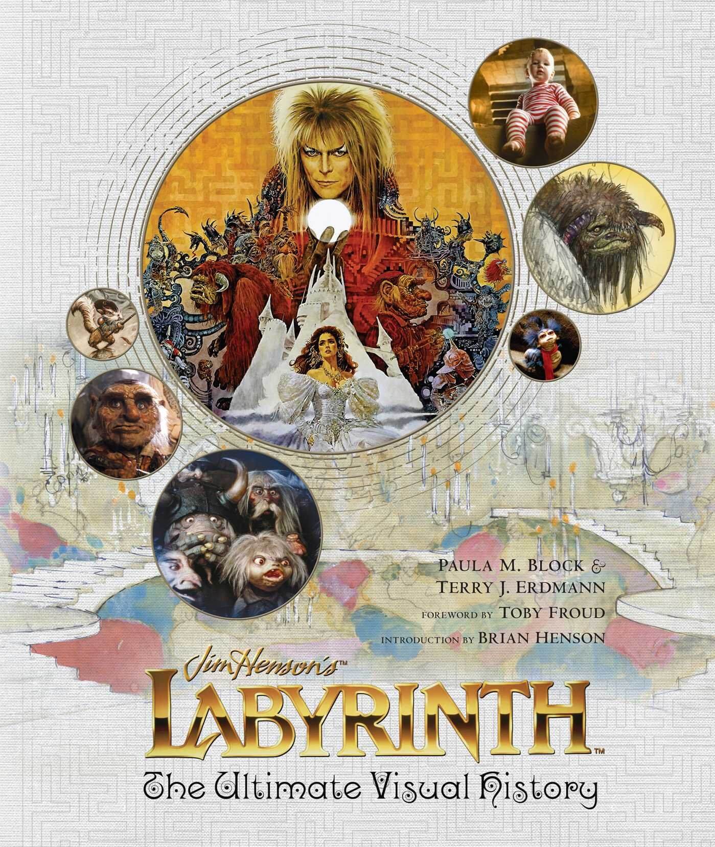 Cover of the book 'Labyrinth: The Ultimate Visual History' featuring an illustration of the character Sarah with the Goblin King in the background, surrounded by fantastical creatures and a snowy landscape.