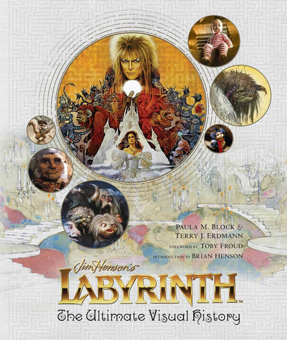 Cover of the book 'Labyrinth: The Ultimate Visual History' featuring an illustration of the character Sarah with the Goblin King in the background, surrounded by fantastical creatures and a snowy landscape.