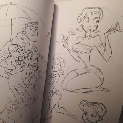 An open sketchbook showing hand-drawn anime-style character illustrations on white paper, with pencil lines and rough facial features and body shapes.