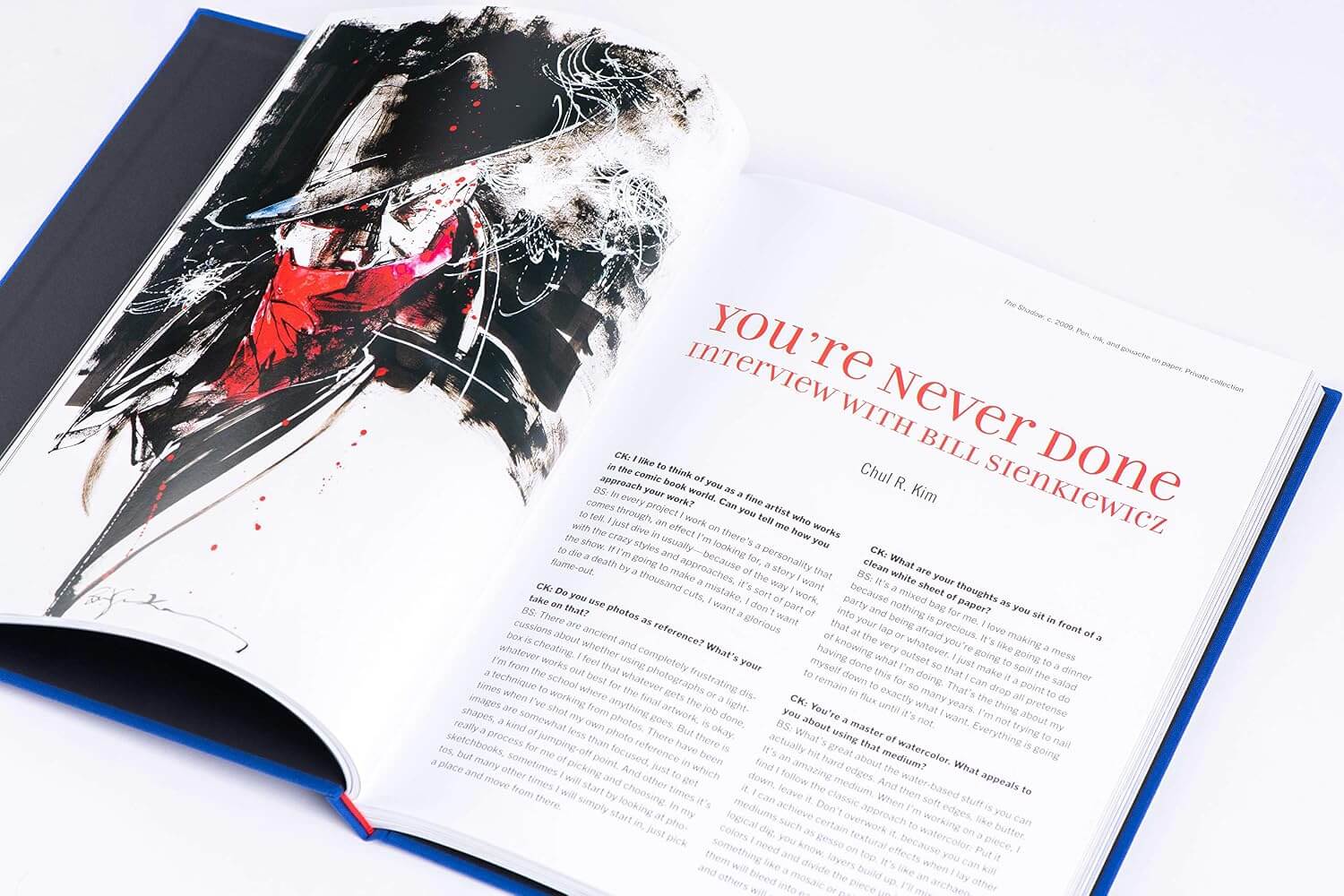 Open pages of Bill Sienkiewicz Revolution art book showcasing illustrated text layout.