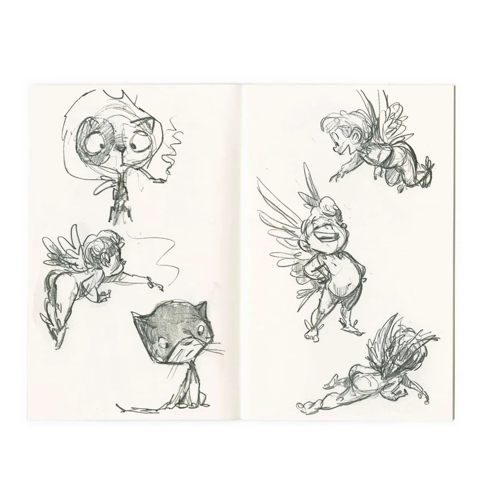 An open sketchbook displaying hand-drawn character designs, including winged fairies and a cat, in dark ink on off-white paper.