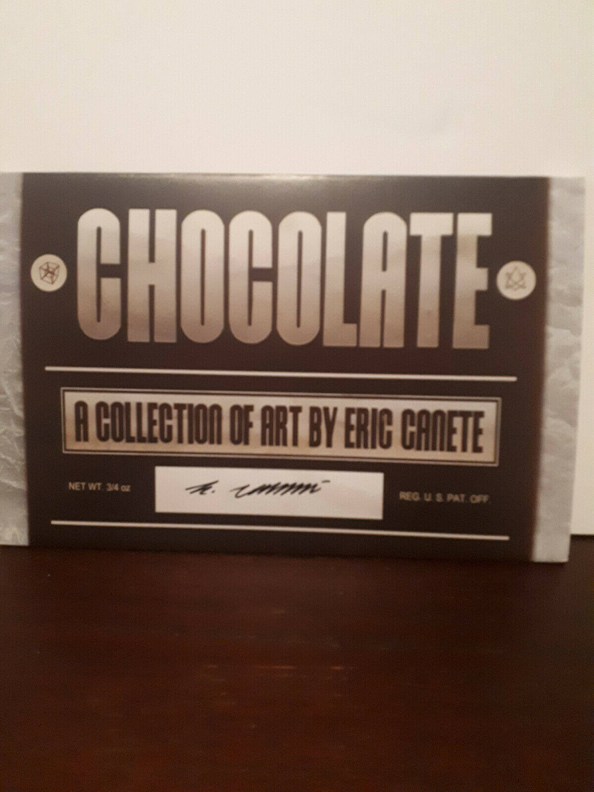 A chocolate-themed sketchbook cover signed by Eric Canete, featuring text and decorative elements that mimic the appearance of a chocolate bar wrapper.