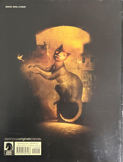 The back cover of the graphic novel 'Dark Horse Originals: dave mckean cages' featuring a surreal illustration of a cat sitting on a stool in a dimly lit room, looking up at an archway with a small bird floating nearby.