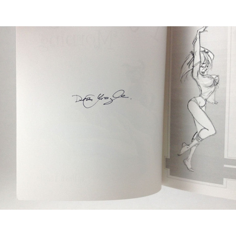An open book or printed booklet showing a white left page with a black signature and a gray right page with a black-and-white sketch of a woman in a pose.