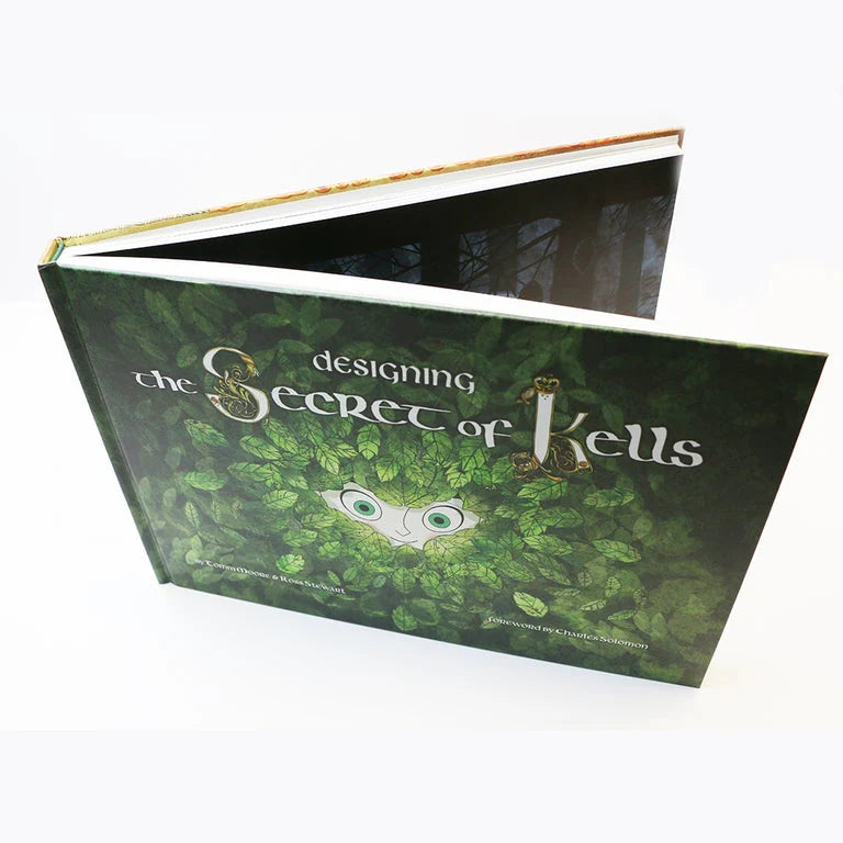 Book titled 'Designing the Secret of Kells' with green cover and white text on a white background