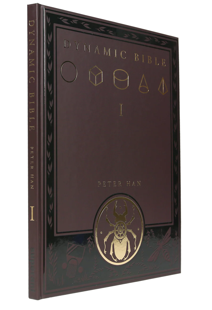 The Dynamic Bible Volume I (Mathematically Derived) by Peter Han, featuring a dark brown leather-like cover with gold foil geometric symbols and a beetle illustration.