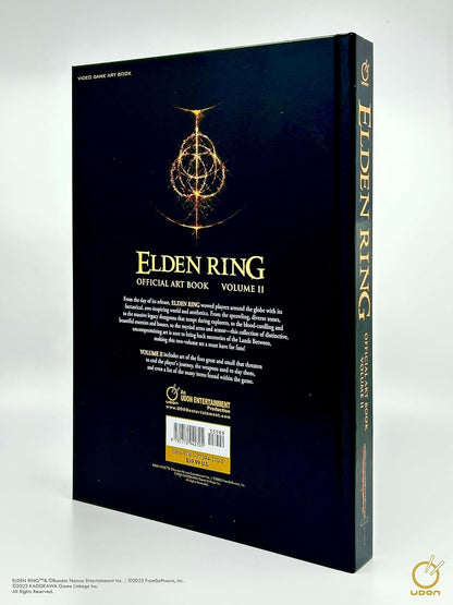 The back cover and spine of the Elden Ring Official Art Book Volume II, featuring a dark navy blue background with gold text and a glowing golden emblem, photographed on a light gray background.