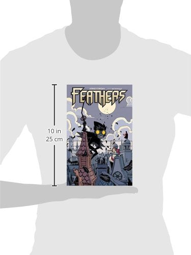 A graphic print on a t-shirt mockup showing a comic book cover titled 'FEATHERS' with a black cat and a tower under a full moon. A vertical measurement marker on the left indicates 10 in (25 cm) height.