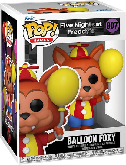 Funko Pop! Games vinyl figure of Balloon Foxy from Five Nights at Freddy's, number 907 in the series. The figure is depicted inside its original retail packaging, which features a white box with a clear front window showing the stylized fox figure holding two yellow balloons.