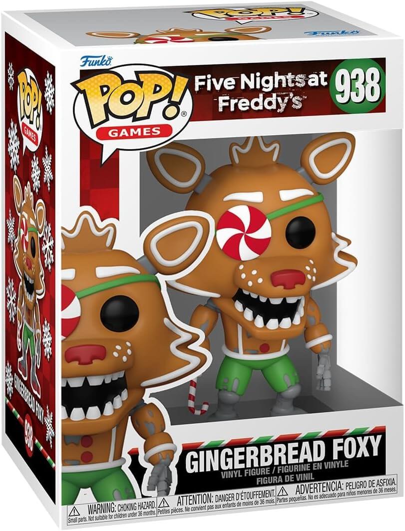 Funko Pop! Games vinyl figure of Five Nights at Freddy's 'Gingerbread Foxy' (number 938) in its original retail packaging. The figure is depicted as a gingerbread fox with green pants, a red and white peppermint patch on its eye, and a red striped neck, set against a white background with red and green accents.