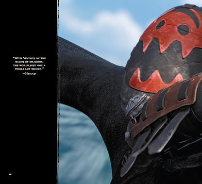 A close-up photograph of a dragon wearing a black and red patterned helmet, with ocean and sky in the background. A black vertical band on the left contains a quote attributed to Hiccup.