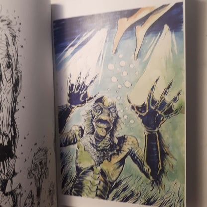 A close-up of an illustrated page showing a monstrous creature with clawed hands reaching upward in a blue-green underwater scene, with partial black line art visible on the left page.