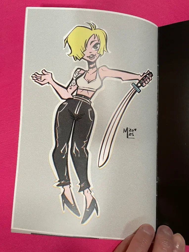 A die-cut sticker of a cartoon-style blonde woman holding a sword, shown on an open book held by fingers against a bright pink background.