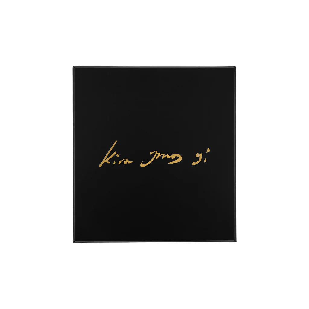 Black square with gold text 'Kira Jang' on a white background