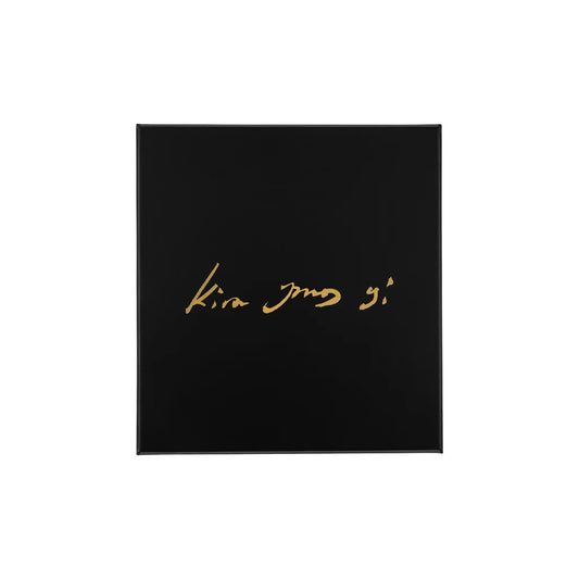 Black square with gold text 'Kira Jang' on a white background