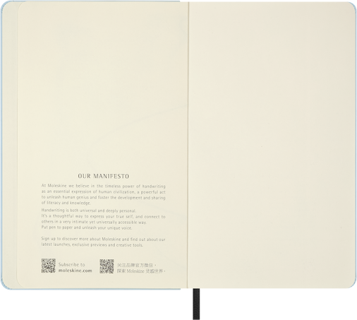 Open notebook displaying a manifesto on cream-colored pages.