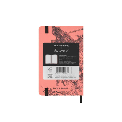 Moleskine notebook with pink cover and black text on a white background
