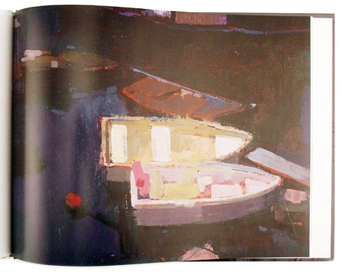 An open book or art print showing a painted scene of small boats in dark, moody tones with yellow and pink highlights.