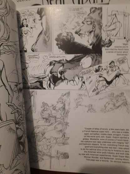 An open book showing printed black-and-white comic-style illustrations and text pages, photographed from above at a slight angle.