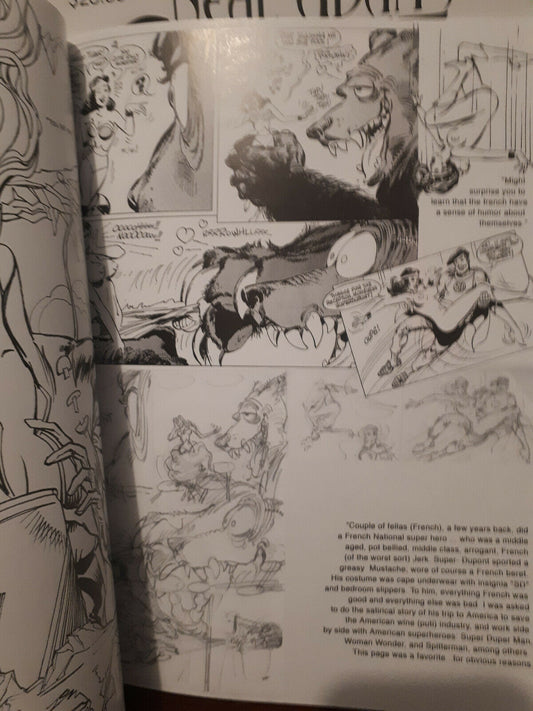 An open book showing printed black-and-white comic-style illustrations and text pages, photographed from above at a slight angle.