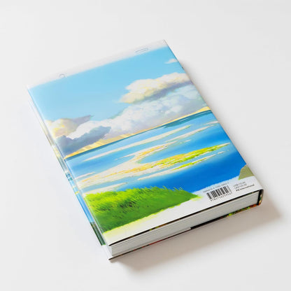 Book with a scenic cover featuring a blue sky and green landscape on a white background