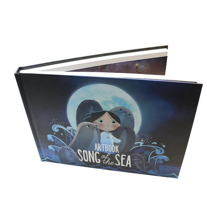 Artbook titled 'Song of the Sea' with illustration of a girl and sea creatures on a dark blue background.