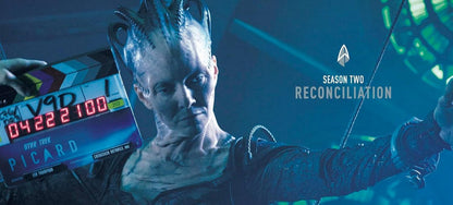 Character from a science fiction series with a clapperboard and 'PICARD' text, featuring 'Season Two Reconciliation'.