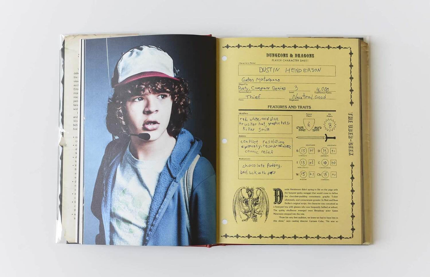 An open book or album cover showing a printed page with a portrait of a person on the left and a yellowed character-style profile sheet with handwritten notes and diagrams on the right.