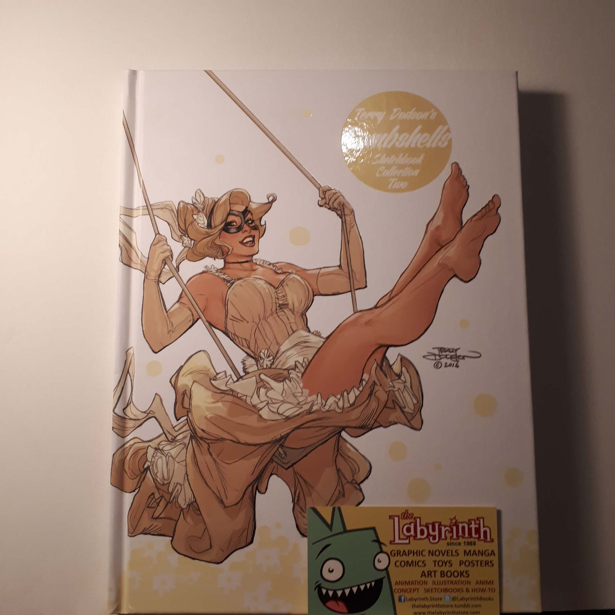 Signed Hardcover sketchbook with a illustrated character on the cover, titled Terry Dodson Bombshells 2.