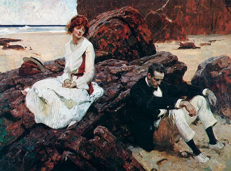 A classical oil painting depicting a romantic seaside scene with a woman in a white dress seated on large reddish rocks beside a man in dark clothing on sandy beach ground.