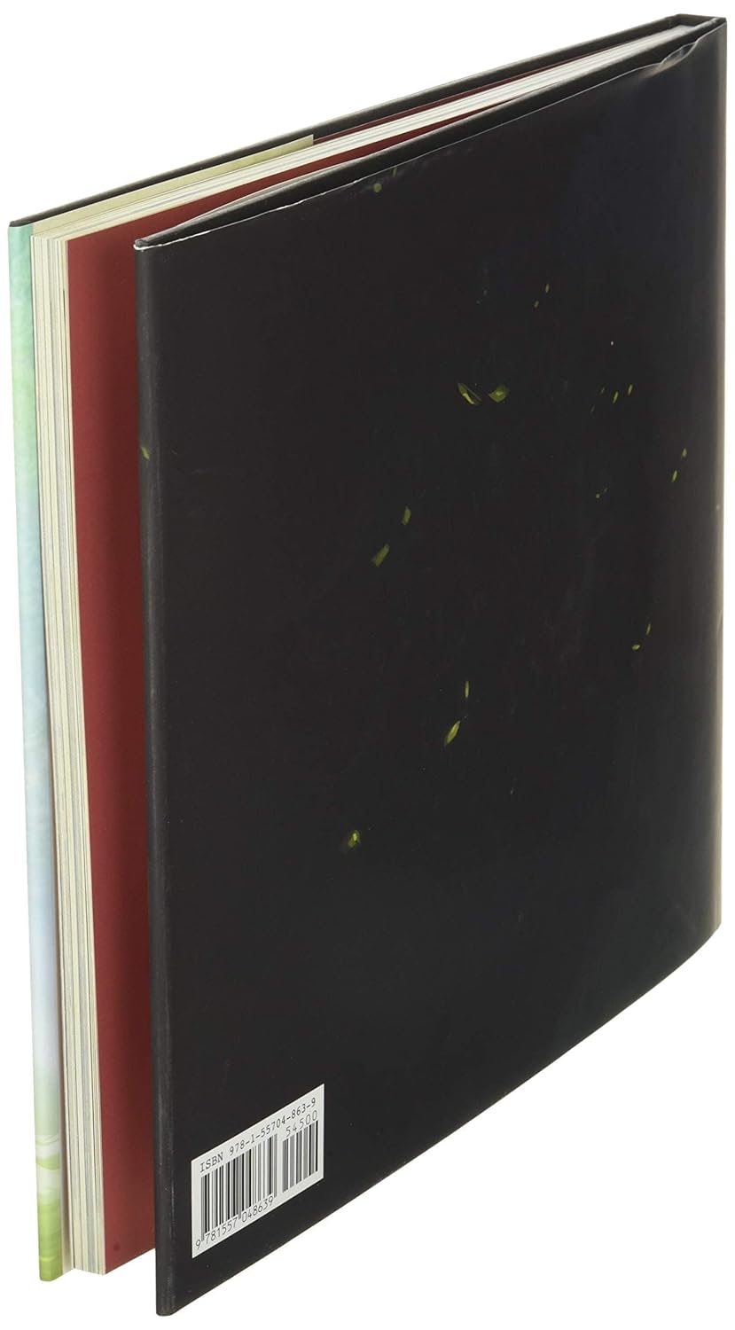 A hardcover notebook or journal shown at an angle, displaying a black cover with small green leaf inclusions and a barcode label near the bottom. The spine and inner pages show red, green, and white accents.