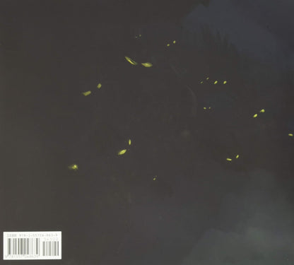 Dark artwork featuring small glowing yellow firefly-like lights against a nearly black background, with a barcode label in the lower-left corner.