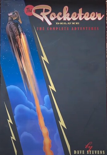 The Rocketeer Deluxe: The Complete Adventures book cover by Dave Stevens, featuring a rocket launching into a blue sky with clouds, a black side panel with yellow lightning, and the title in large gold lettering.