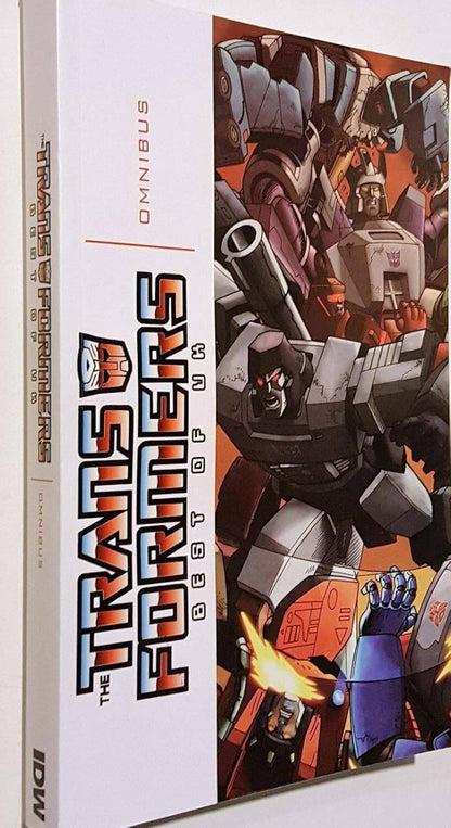 Angled view of the Transformers Best of UK Omnibus paperback showing the spine and cover branding.