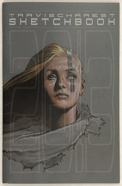 Travischarest Sketchbook featuring a stylized sketch illustration of a woman's face with blonde hair and a gray scarf, set against a dark gray background with the title text at the top.
