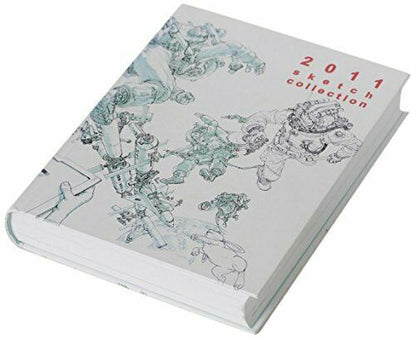 A kim jung gi sketchbook 2011 with a white and red cover featuring drawings in a stylized script.
